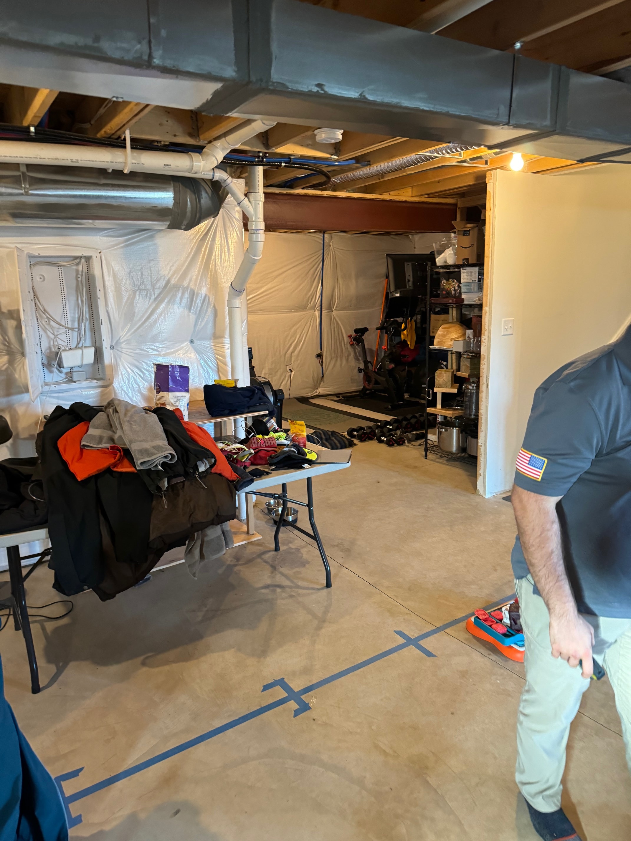 Basement during construction showing rough plumbing and mechanicals