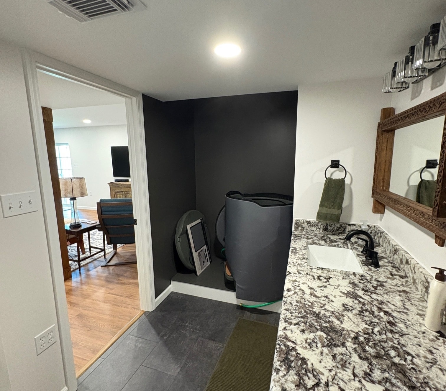 Finished basement bathroom with granite countertop