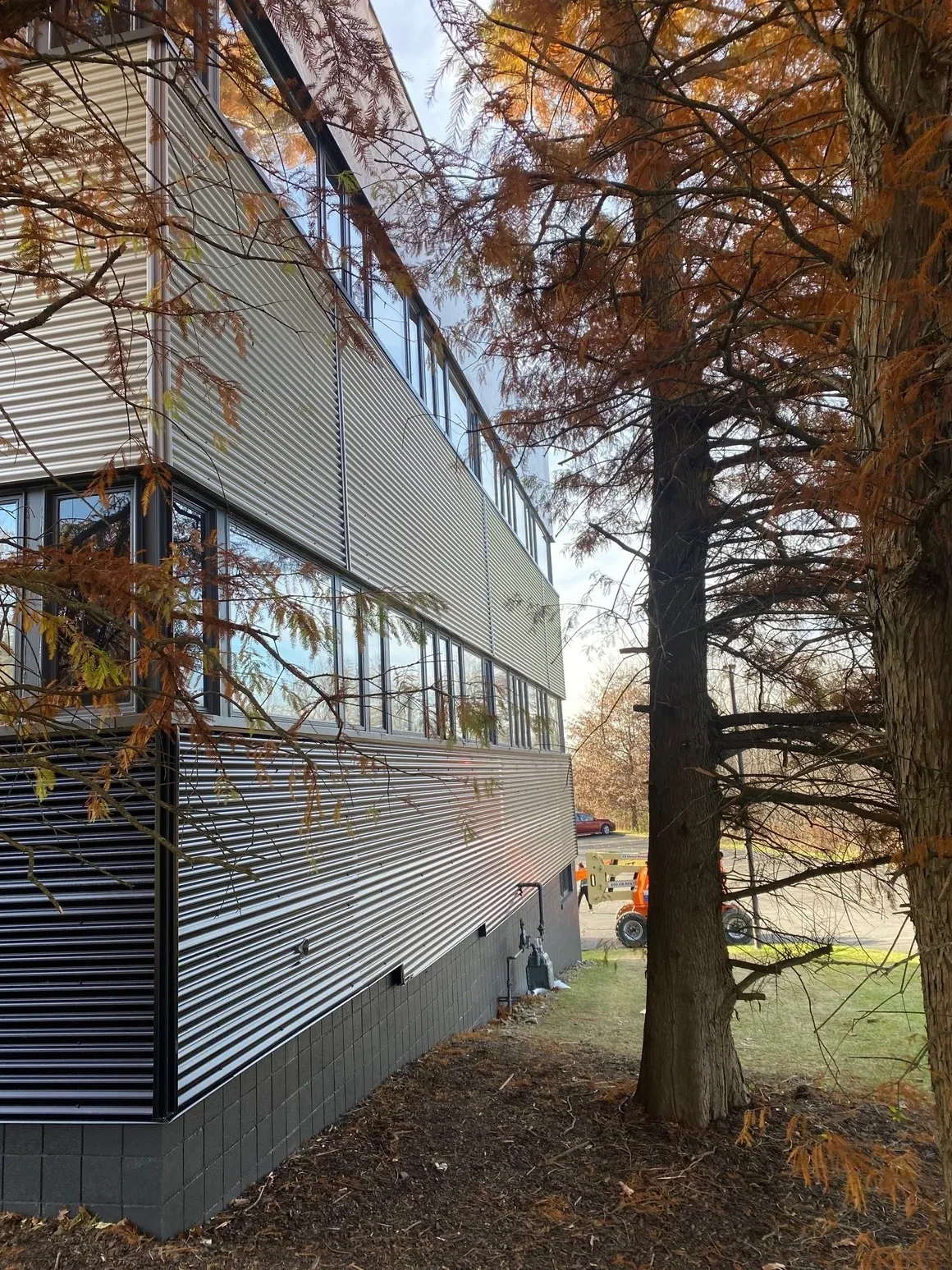 New corrugated metal panel siding installed on commercial building exterior