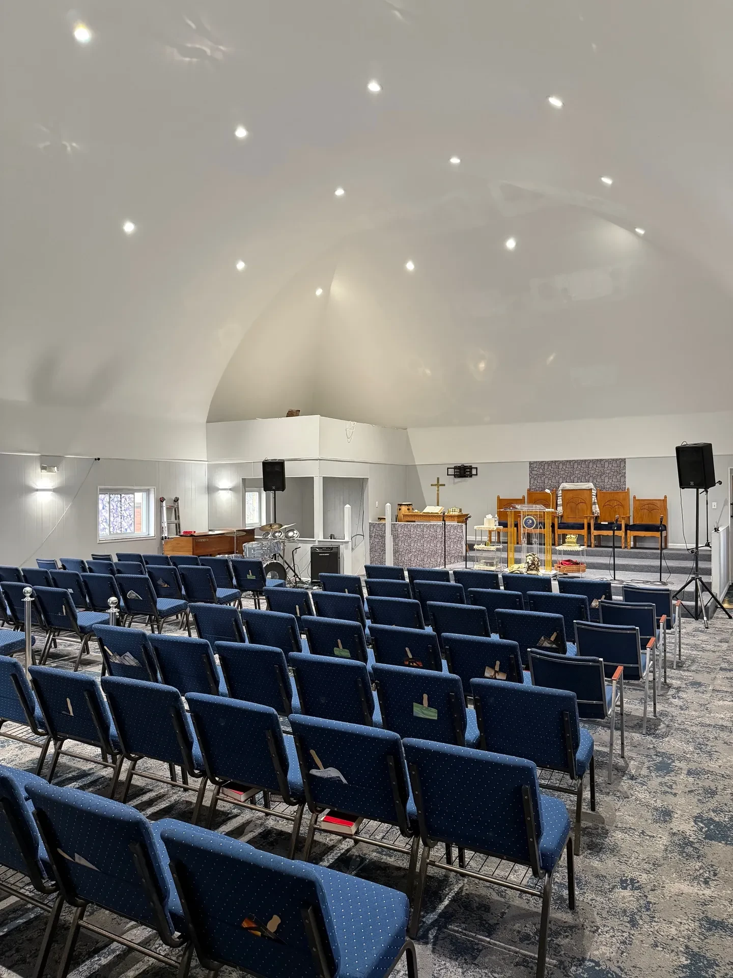 Completed church interior restoration showing full seating and altar area