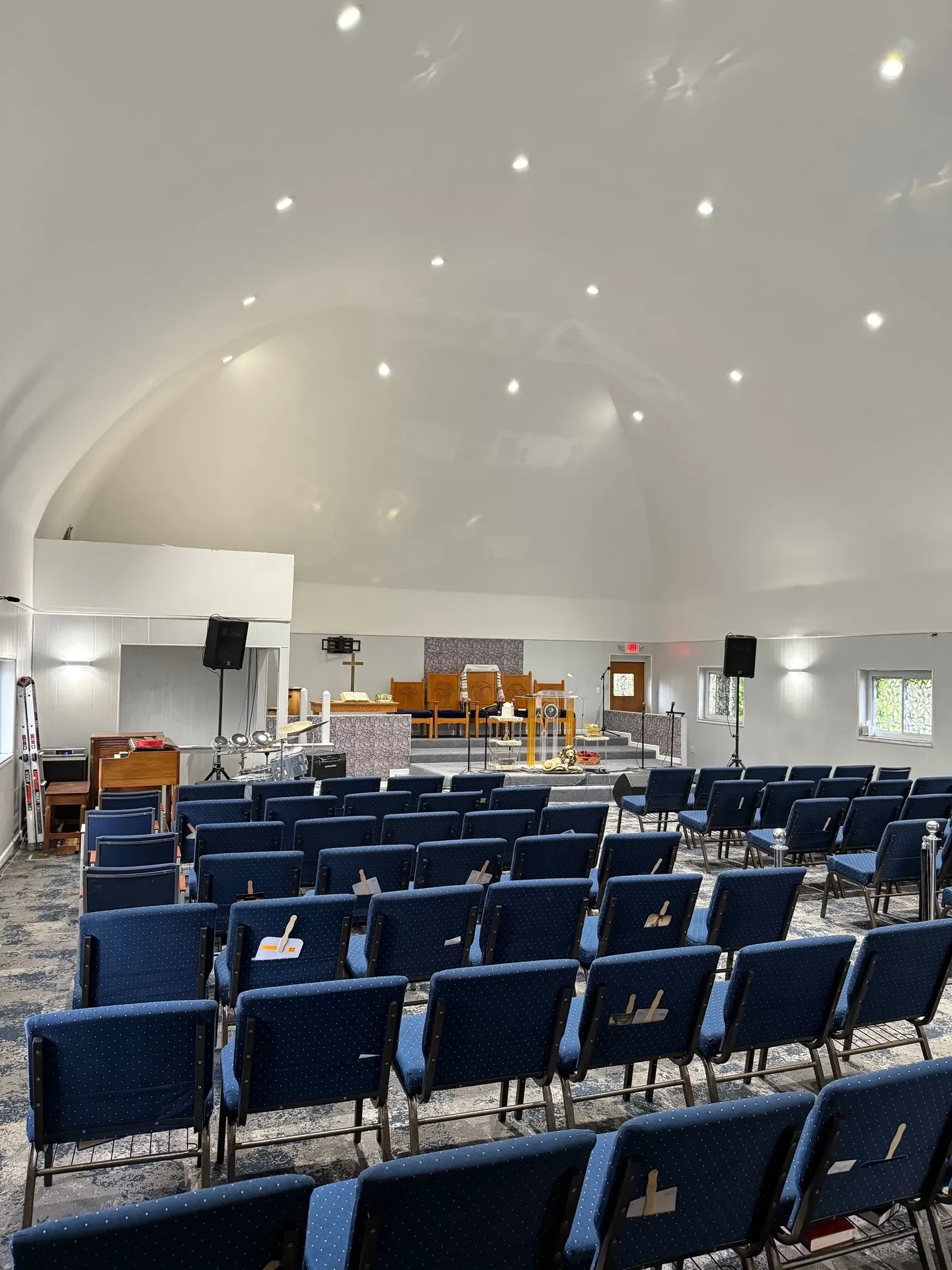 Finished church sanctuary from rear showing restored arched ceiling and altar
