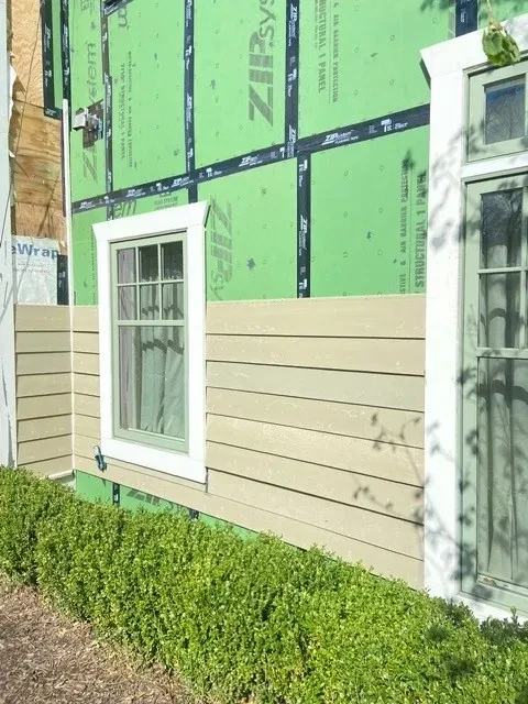 ZIP System sheathing with new siding partially reinstalled