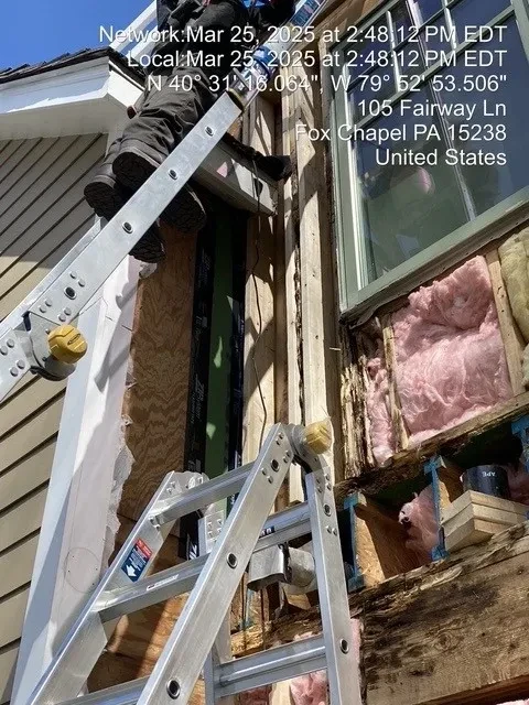 Water damage and structural deterioration with rotted framing exposed